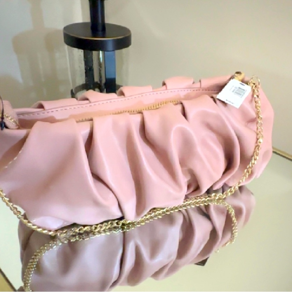 Moth. Pink express over the shoulder clutch bag.